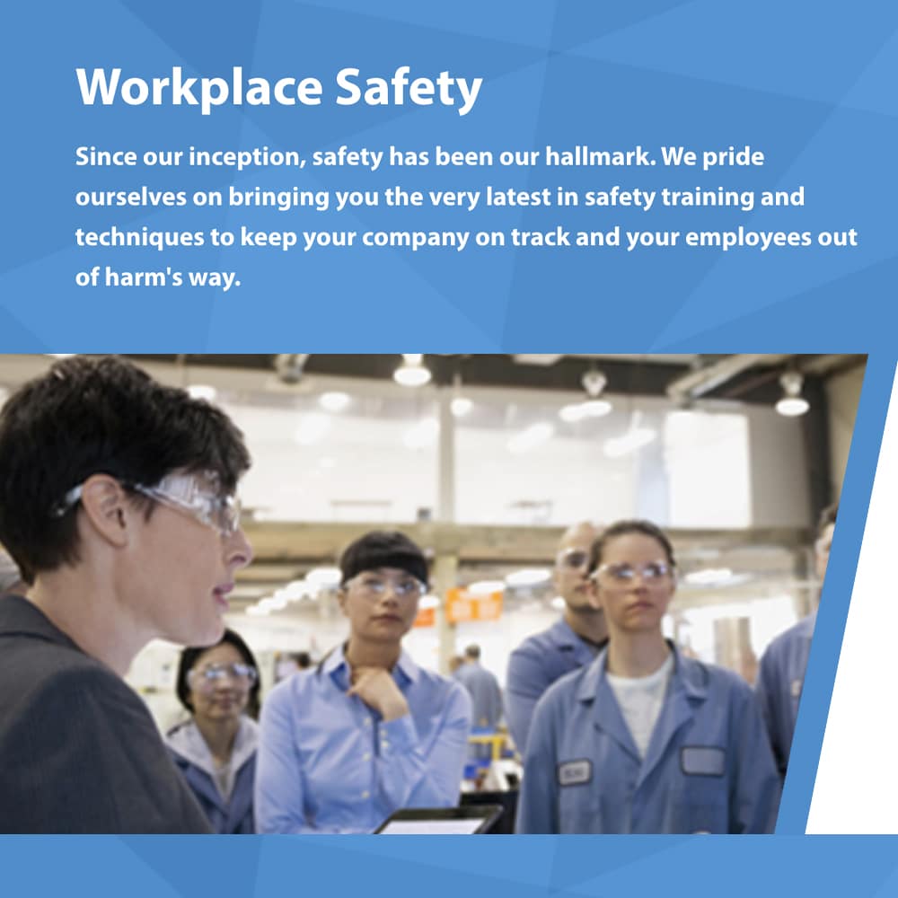 employees wearing safety glasses having workplace safety meeting