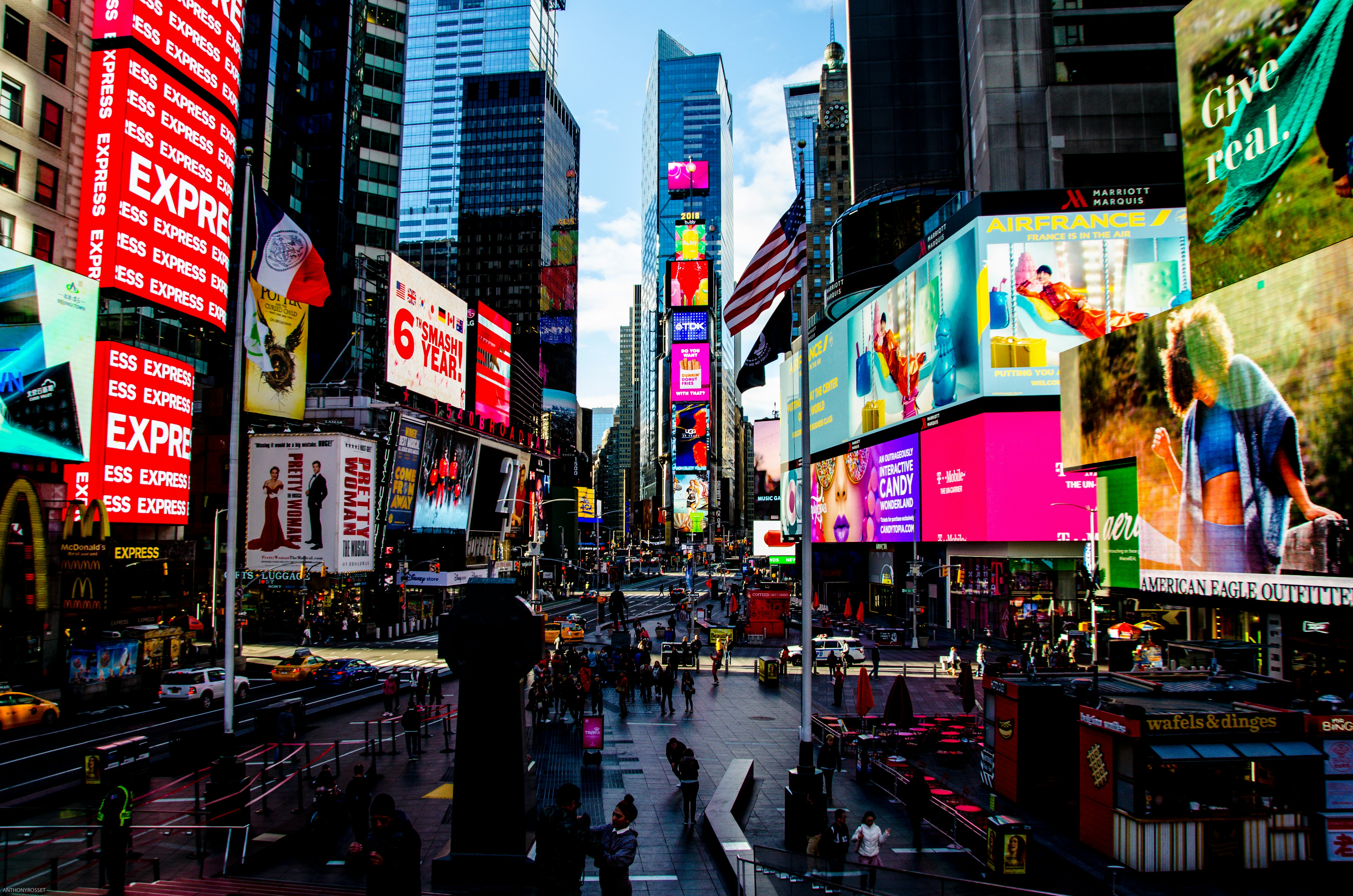 photo of advertisements on billboards in Times Square in New York